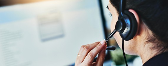 Rearview shot of a young woman working in a call centre