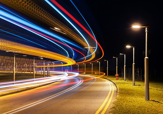 Street lights lining a busy road to depict fewer outages, faster restoration