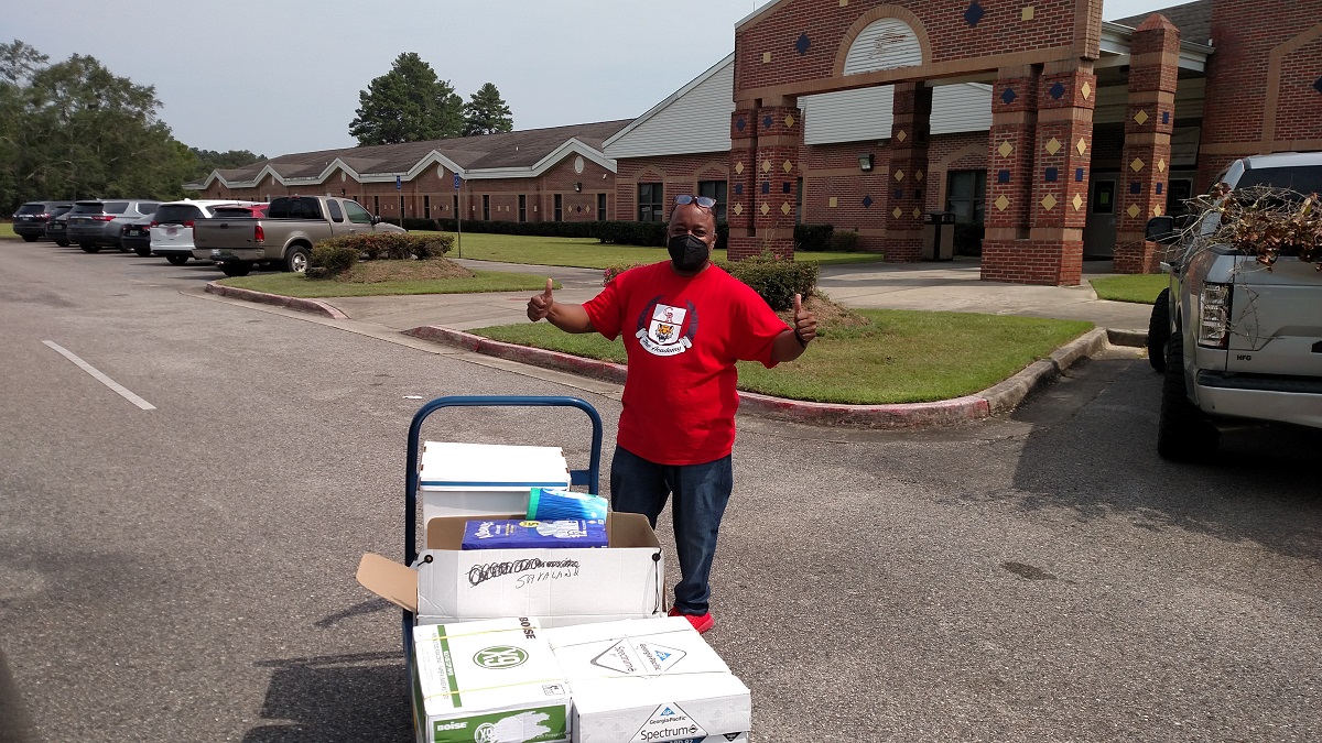 Volunteers are engaged in backpack drives and distributing school supplies.