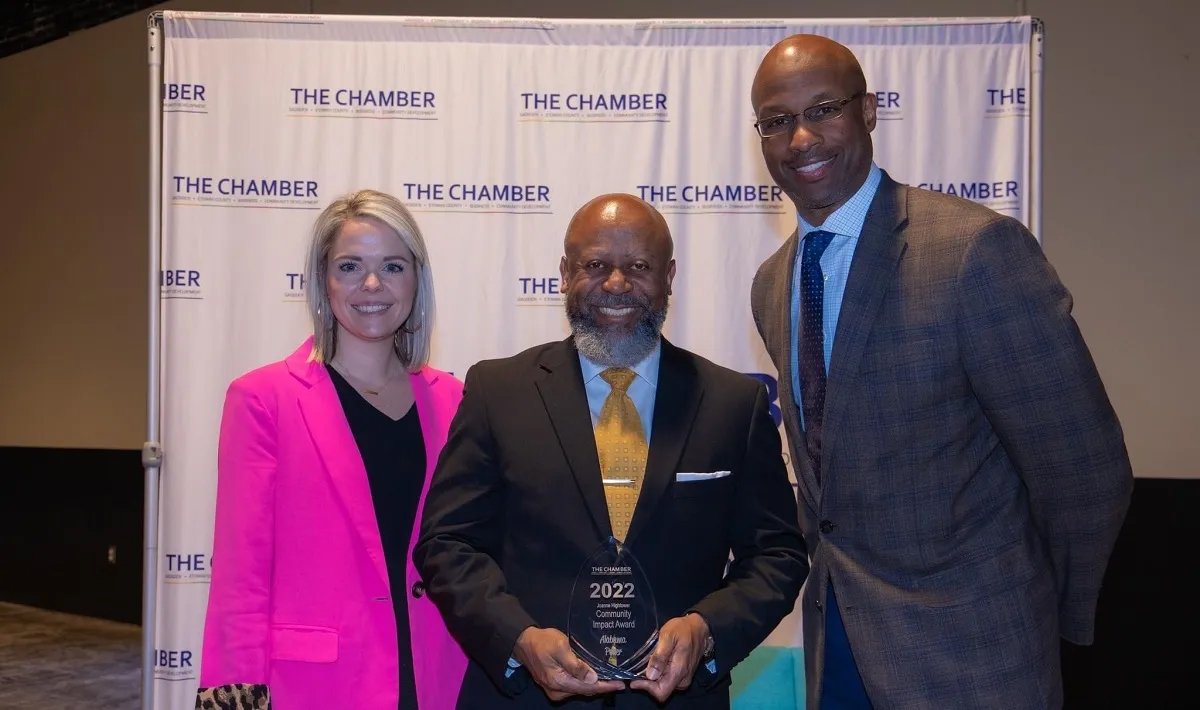 Alabama Power's Jacki-Lyn Lowry, Tony Smith and Terry Smiley with the Joanne Hightower Community Impact Award. (contributed)