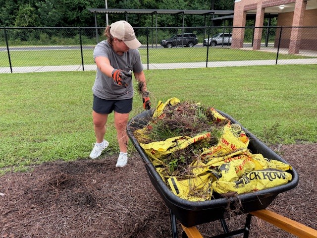 Volunteers for the Plant Barry chapter of the Alabama Power Service Organization worked to improve the outdoor classroom at Lee Elementary School in Satsuma.