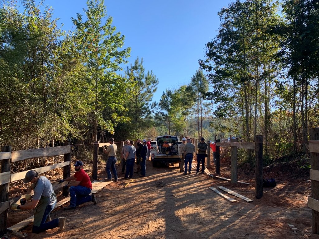 Alabama Power crews and volunteers stepped up to install fences and make other improvements to Mustangs and Heroes property.