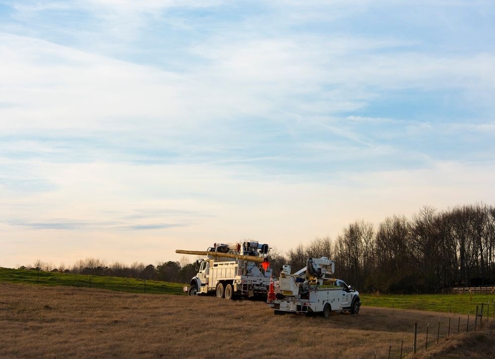 Field with Southern Company fleet trucks