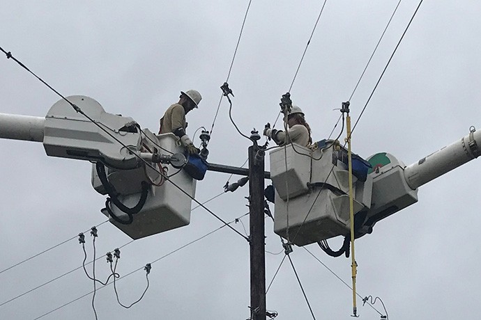 lineworker restoring power