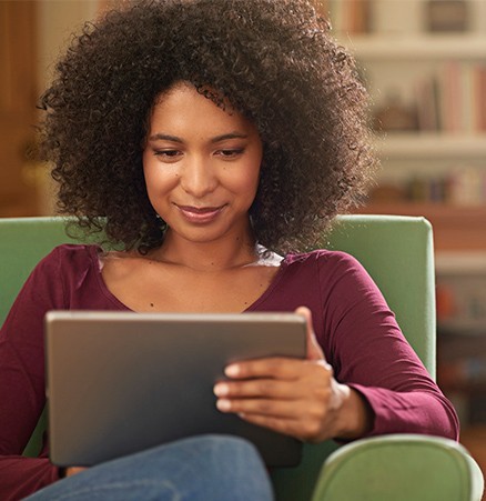 Woman looking at tablet screen