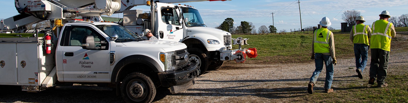 Alabama Power fleet trucks with field workers