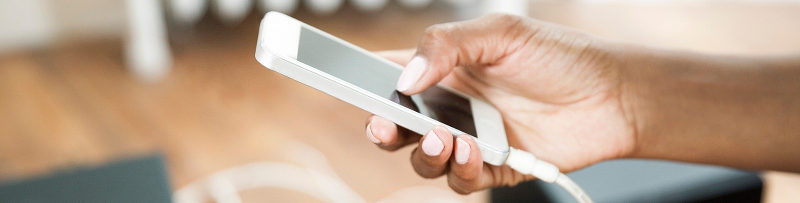 Person's hand holding a cellphone 