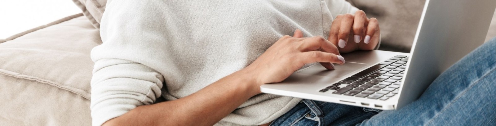 A person typing on their laptop 