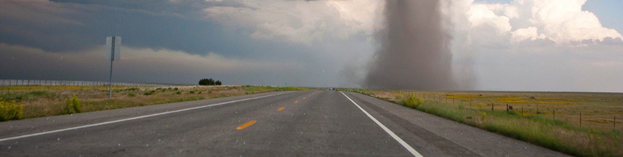Tornado on open landscape