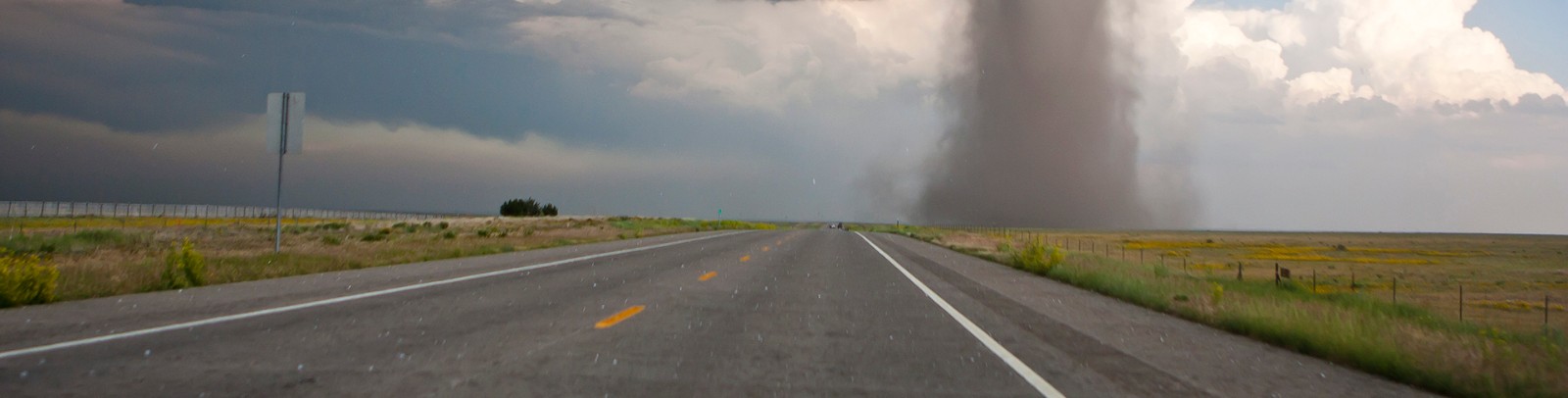 Tornado on open landscape