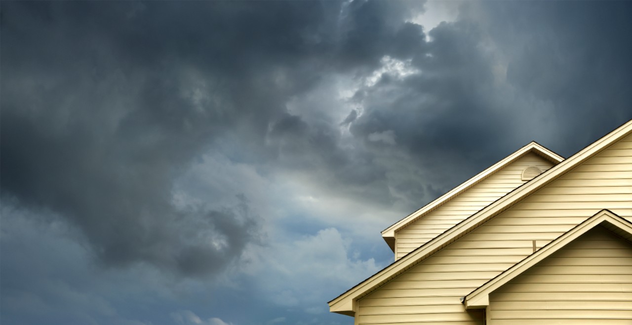 Storm clouds over house 