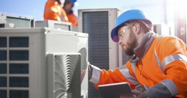 Alabama Power employee servicing an HVAC unit