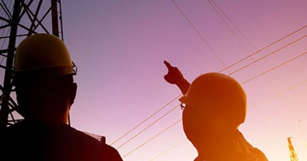 Alabama Power employees surveying power lines and towers