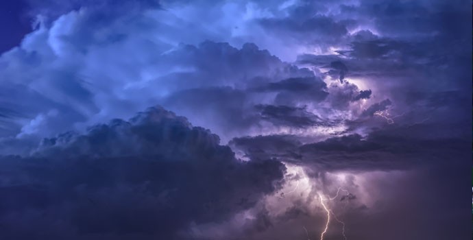 Thunderstorm with lightning flashing in storm clouds